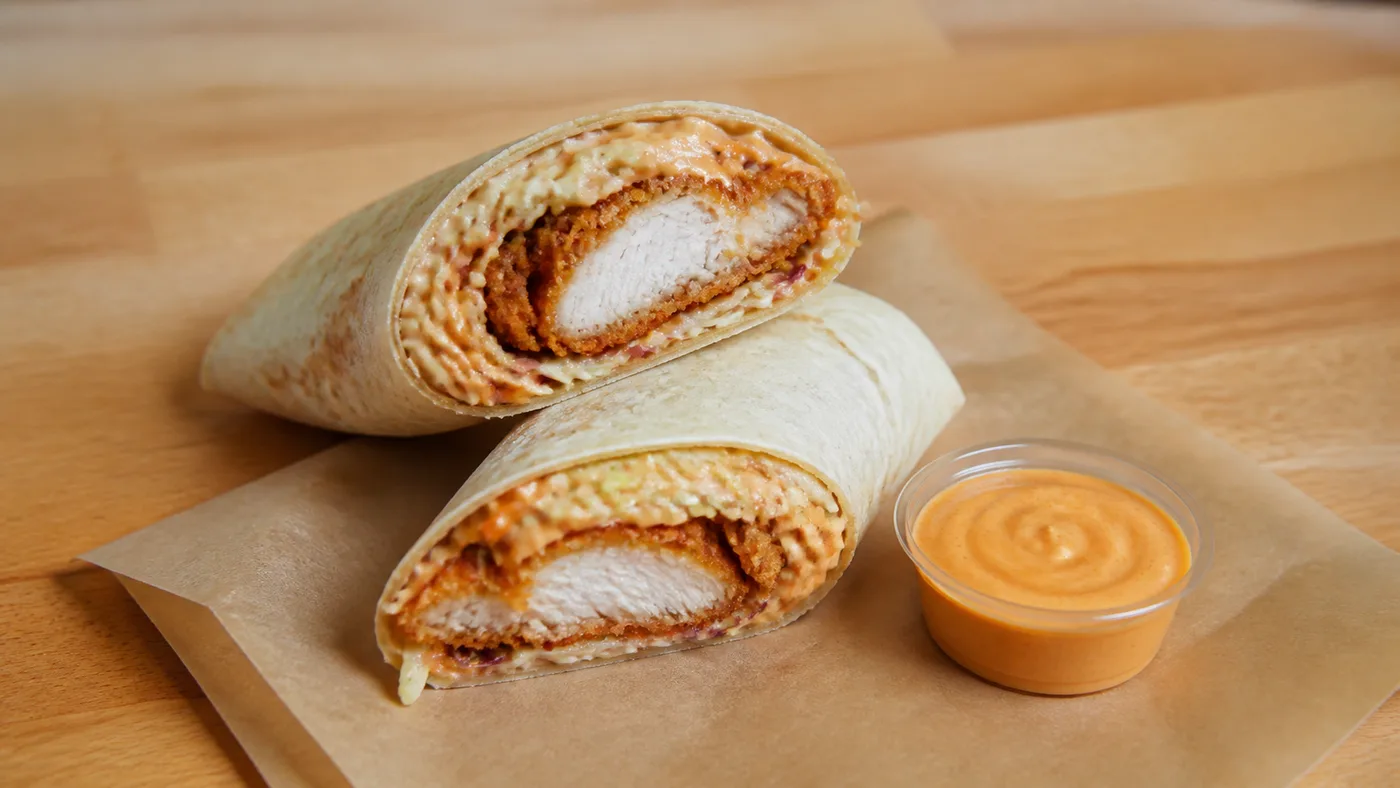 Church's Spicy Tender Wrap with crispy spicy tender, creamy coleslaw, spicy mayo, and warm tortilla